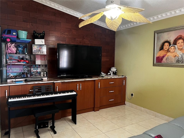 sitting room with light tile patterned floors, a textured ceiling, and ceiling fan