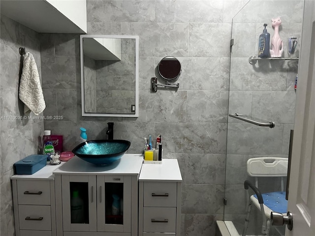 full bath featuring vanity and decorative backsplash