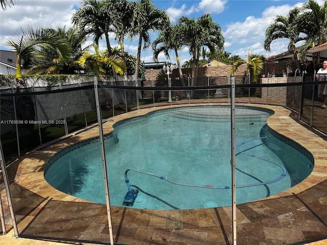 view of pool with a fenced backyard and a fenced in pool