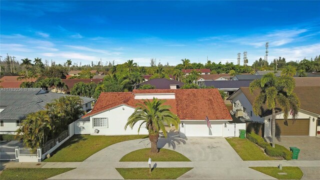 116 SW 135th Ave, Miami, FL 33184 - mediterranean / spanish home featuring stucco siding, an attached garage, a tiled roof, and concrete driveway