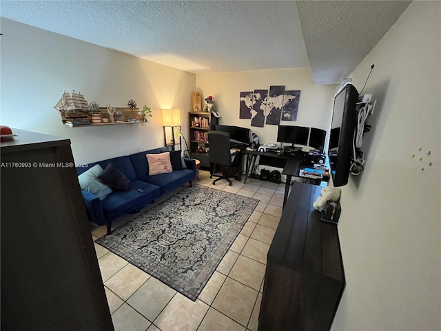 living room featuring light tile patterned floors and a textured ceiling