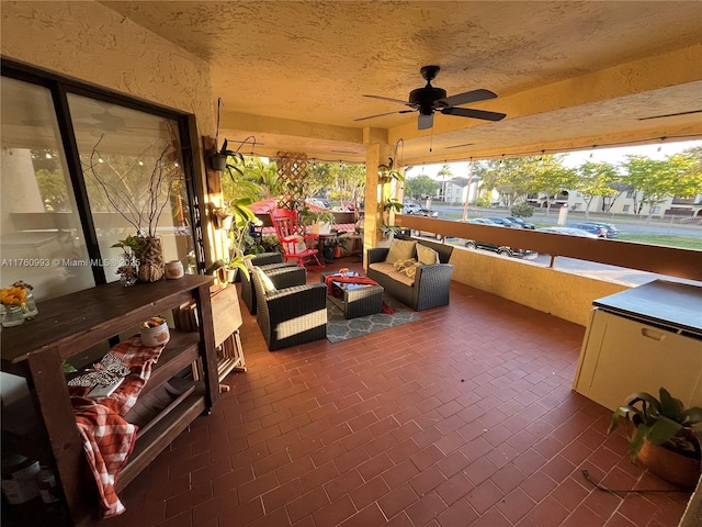 view of patio featuring an outdoor hangout area and ceiling fan
