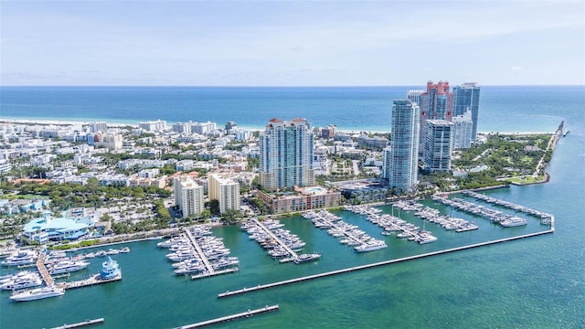 birds eye view of property featuring a view of city and a water view