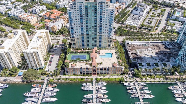 birds eye view of property with a water view and a view of city