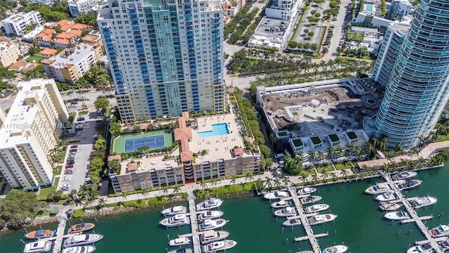 drone / aerial view with a city view and a water view