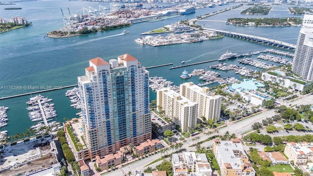 birds eye view of property featuring a city view and a water view