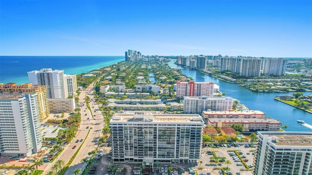 birds eye view of property featuring a view of city and a water view