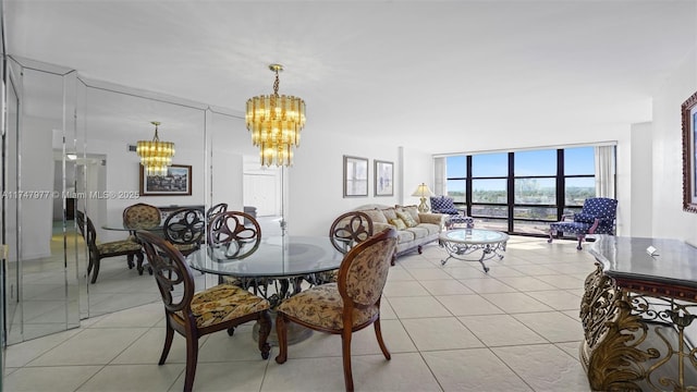 dining space featuring light tile patterned floors, expansive windows, and an inviting chandelier