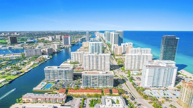 birds eye view of property featuring a water view and a view of city