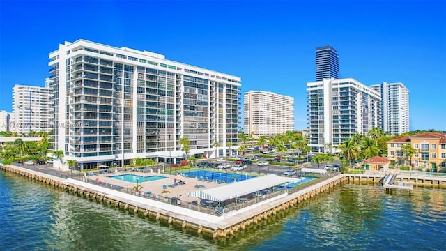 exterior space with a water view and a view of city