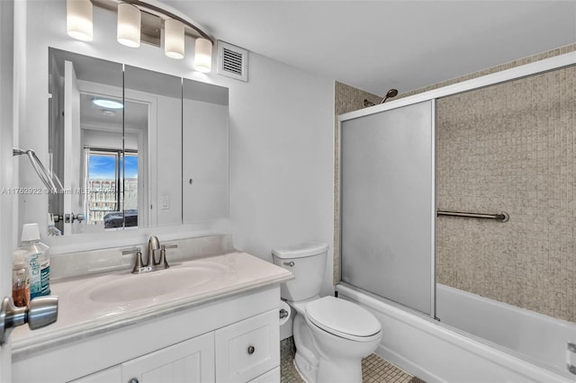 full bathroom with vanity, toilet, visible vents, and enclosed tub / shower combo