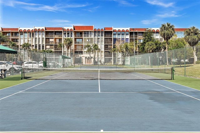 view of sport court with fence