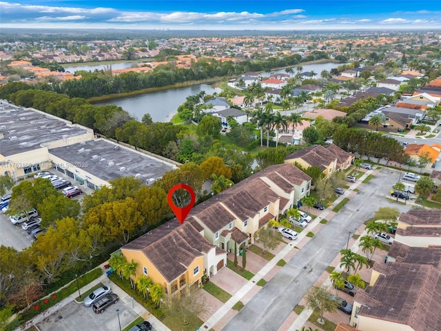 birds eye view of property featuring a water view and a residential view