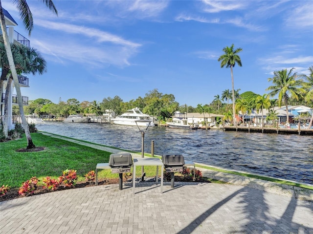 exterior space with a dock and a water view