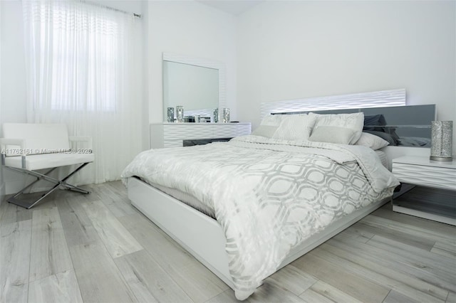 bedroom featuring wood finished floors