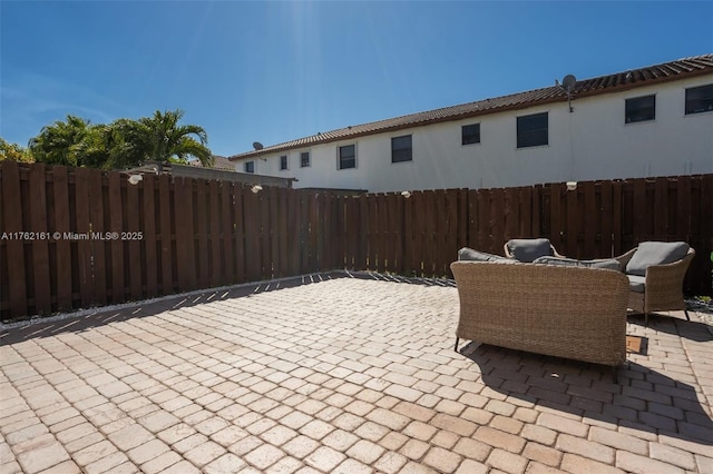 view of patio featuring fence