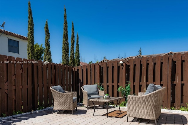 view of patio featuring fence