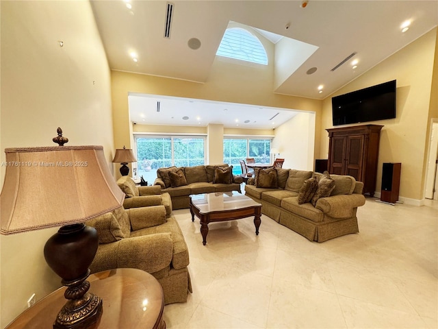 living area with visible vents and high vaulted ceiling