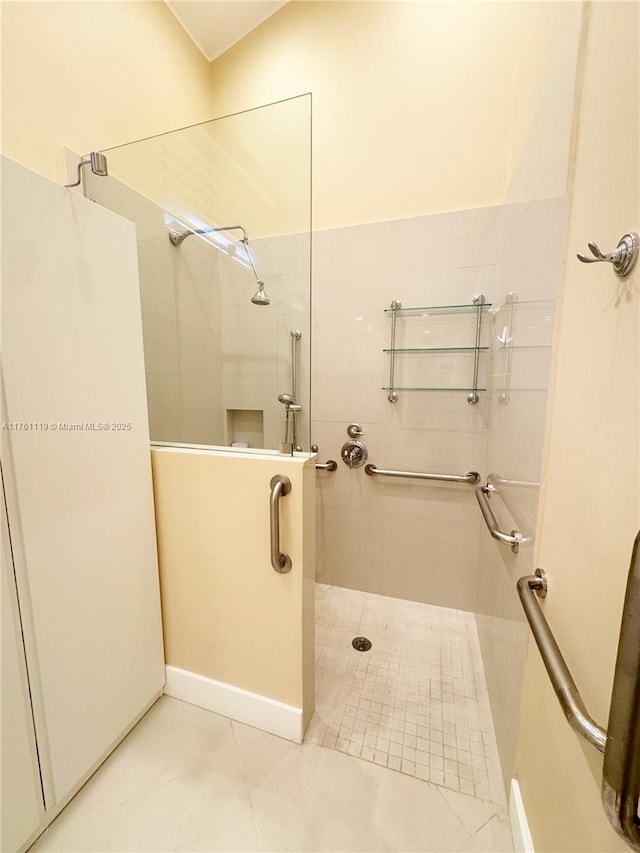 full bath featuring tile patterned floors and walk in shower