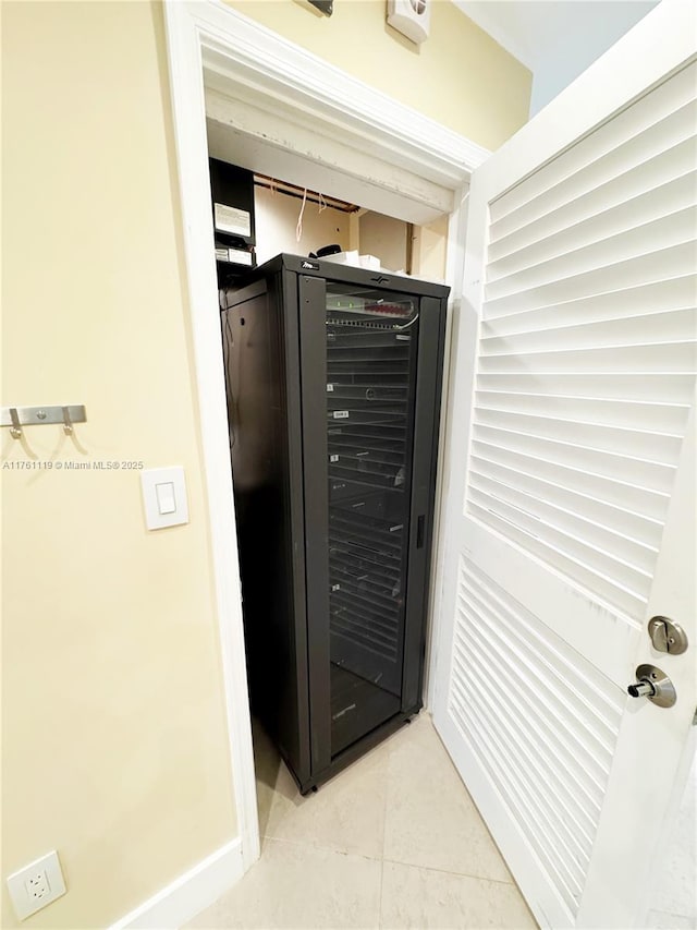 interior space with baseboards and beverage cooler