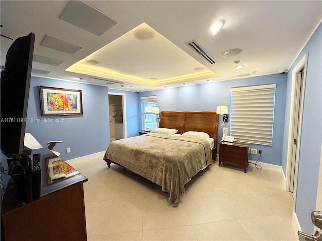 bedroom with a tray ceiling, light tile patterned floors, baseboards, and visible vents