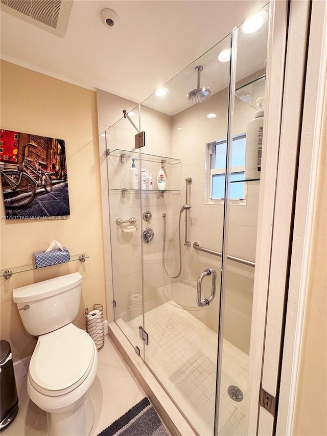 full bathroom with visible vents, toilet, a stall shower, and tile patterned flooring