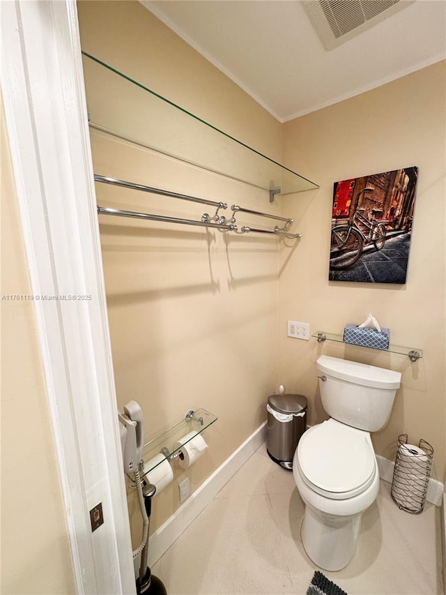 bathroom with visible vents, baseboards, and toilet