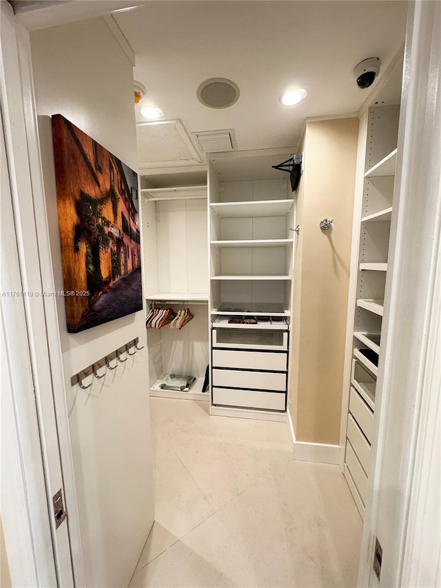 spacious closet featuring tile patterned flooring