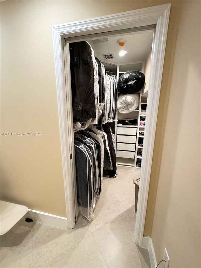 walk in closet with visible vents