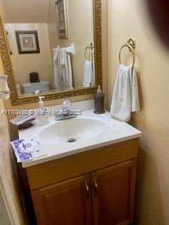 bathroom with vanity and toilet