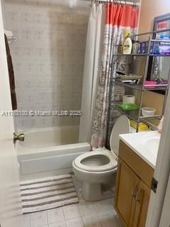 bathroom featuring vanity, shower / tub combo, toilet, and tile patterned flooring