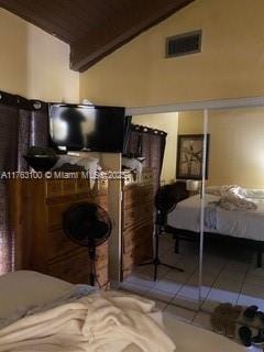 bedroom featuring tile patterned flooring, visible vents, wood ceiling, and lofted ceiling with beams