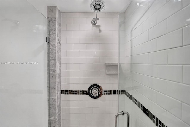 bathroom with a shower stall