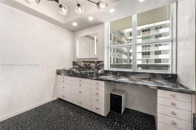 bathroom with recessed lighting, baseboards, and vanity