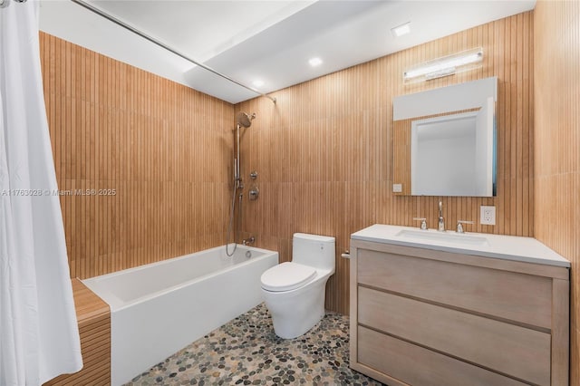 bathroom featuring vanity, toilet, and shower / tub combo with curtain