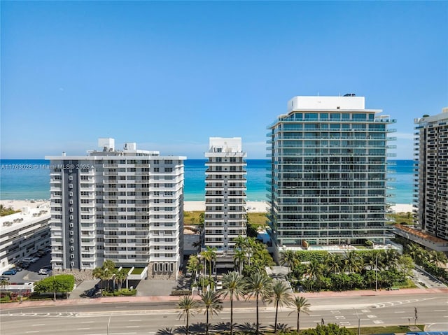 view of building exterior with a city view and a water view