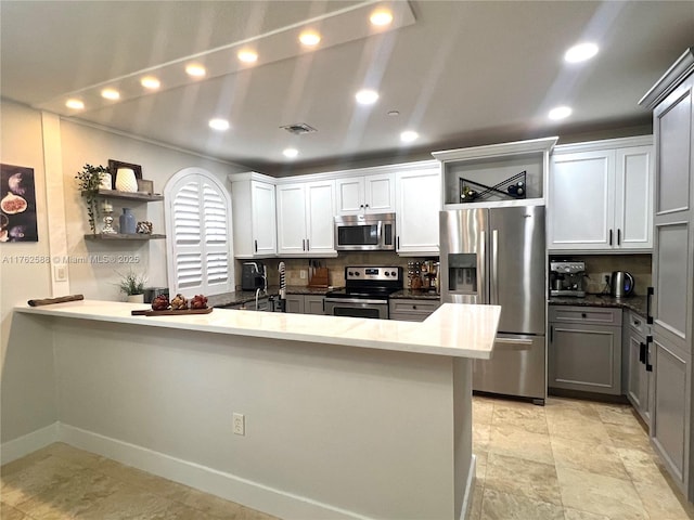 kitchen with visible vents, recessed lighting, appliances with stainless steel finishes, a peninsula, and open shelves