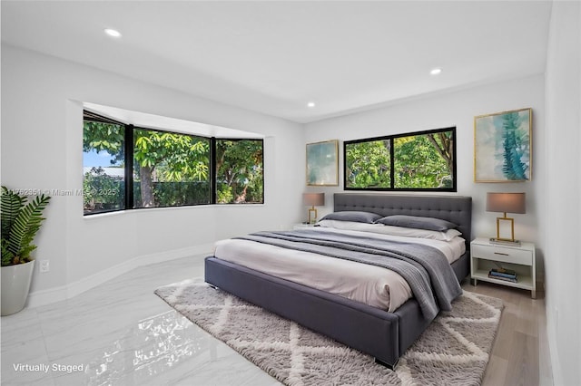 bedroom with recessed lighting and baseboards