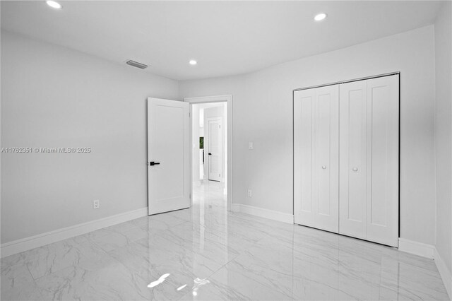 unfurnished bedroom featuring visible vents, recessed lighting, marble finish floor, and baseboards