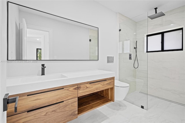 bathroom with a marble finish shower, toilet, vanity, and a wealth of natural light