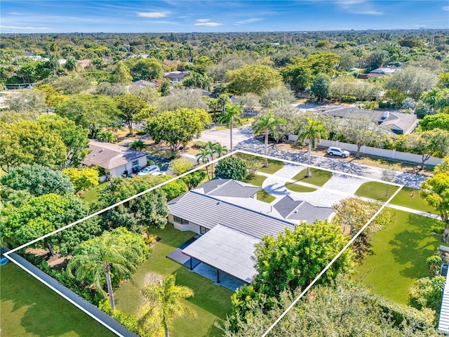 aerial view featuring a wooded view