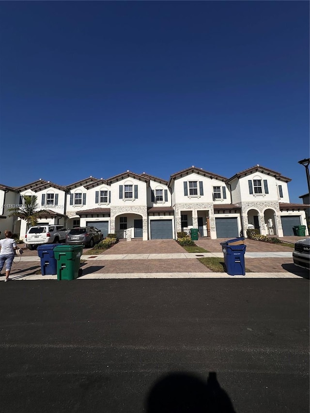 view of front of property featuring driveway and an attached garage