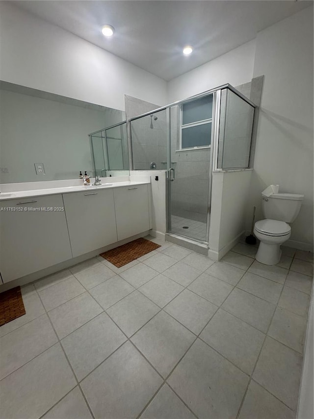 full bathroom with baseboards, toilet, a stall shower, tile patterned floors, and vanity