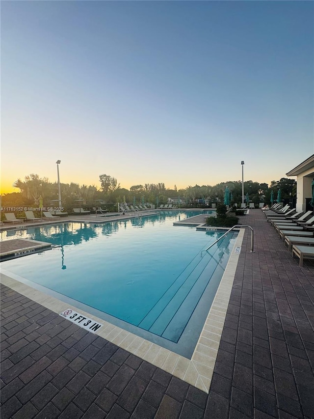 community pool featuring a patio area