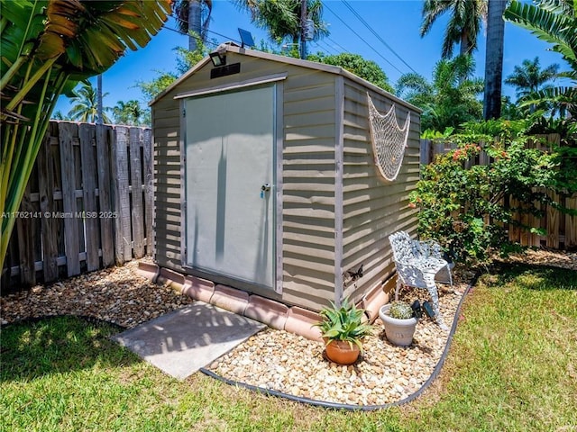 view of shed featuring a fenced backyard