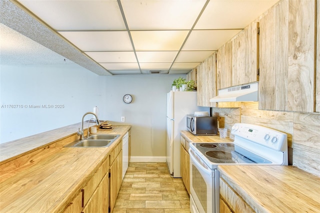 1548 NW 113th Way, Pembroke Pines, FL 33026 - kitchen with a sink, light wood-type flooring, baseboards, white appliances, and light countertops
