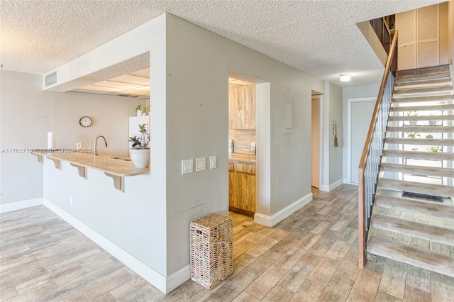 1548 NW 113th Way, Pembroke Pines, FL 33026 - kitchen featuring a sink, a drop ceiling, white appliances, light brown cabinets, and under cabinet range hood