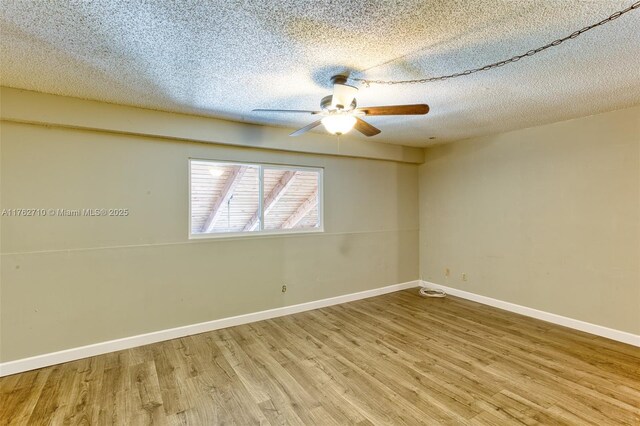 1548 NW 113th Way, Pembroke Pines, FL 33026 - bedroom featuring light wood-type flooring, a textured ceiling, baseboards, and ceiling fan