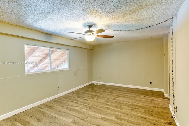 1548 NW 113th Way, Pembroke Pines, FL 33026 - empty room featuring baseboards, a ceiling fan, wood finished floors, and a textured ceiling
