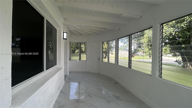 unfurnished sunroom with lofted ceiling with beams and wooden ceiling